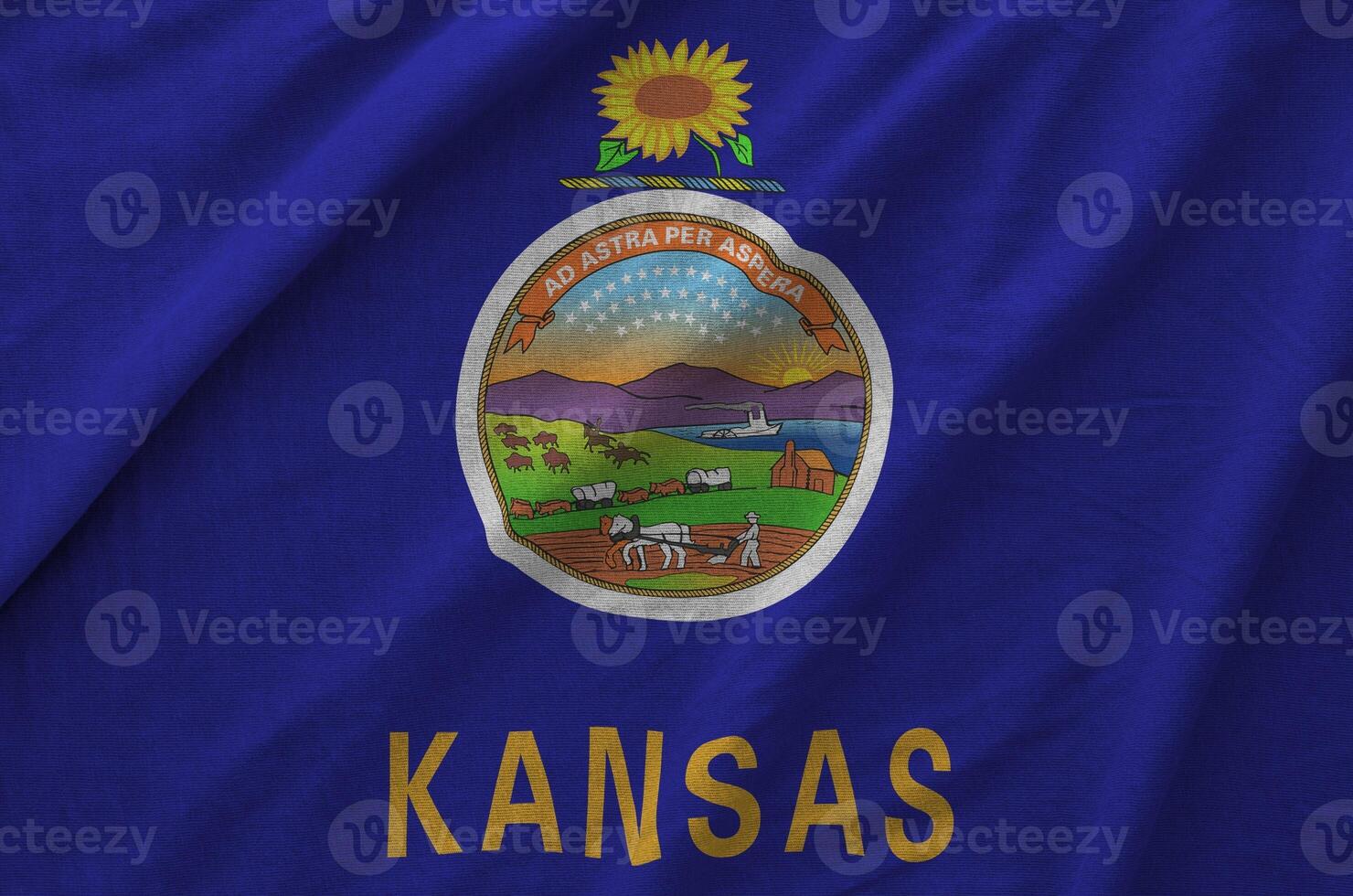 Kansas US state flag depicted on folded wavy fabric of old cloth photo