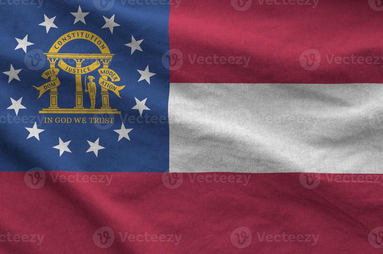 Georgia US state flag depicted on folded wavy fabric of old cloth photo