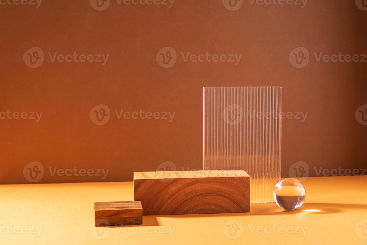 Creative abstract podium from wooden figures and glass, against a brown background with hard light photo