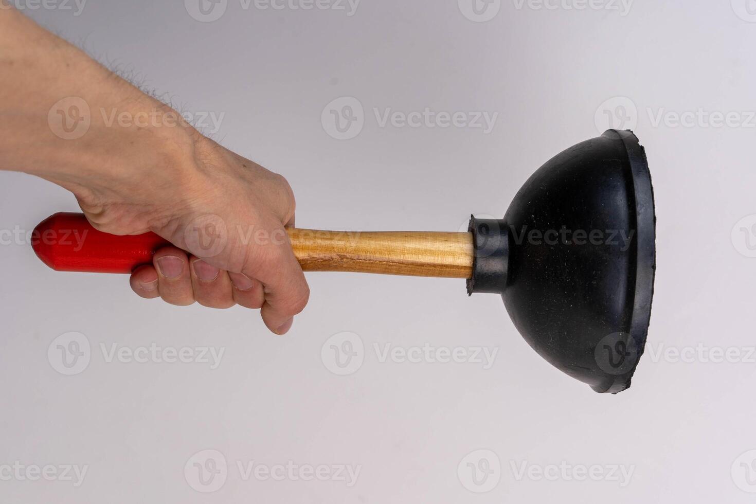 a man's hand firmly holds a plunger for cleaning the sewer. white background photo