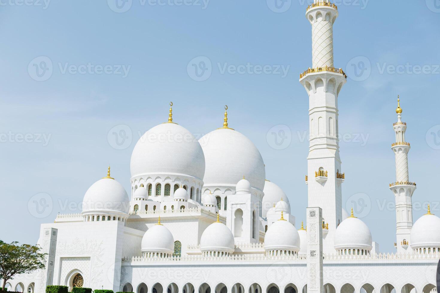 Beautiful white mosque on a sunny day photo