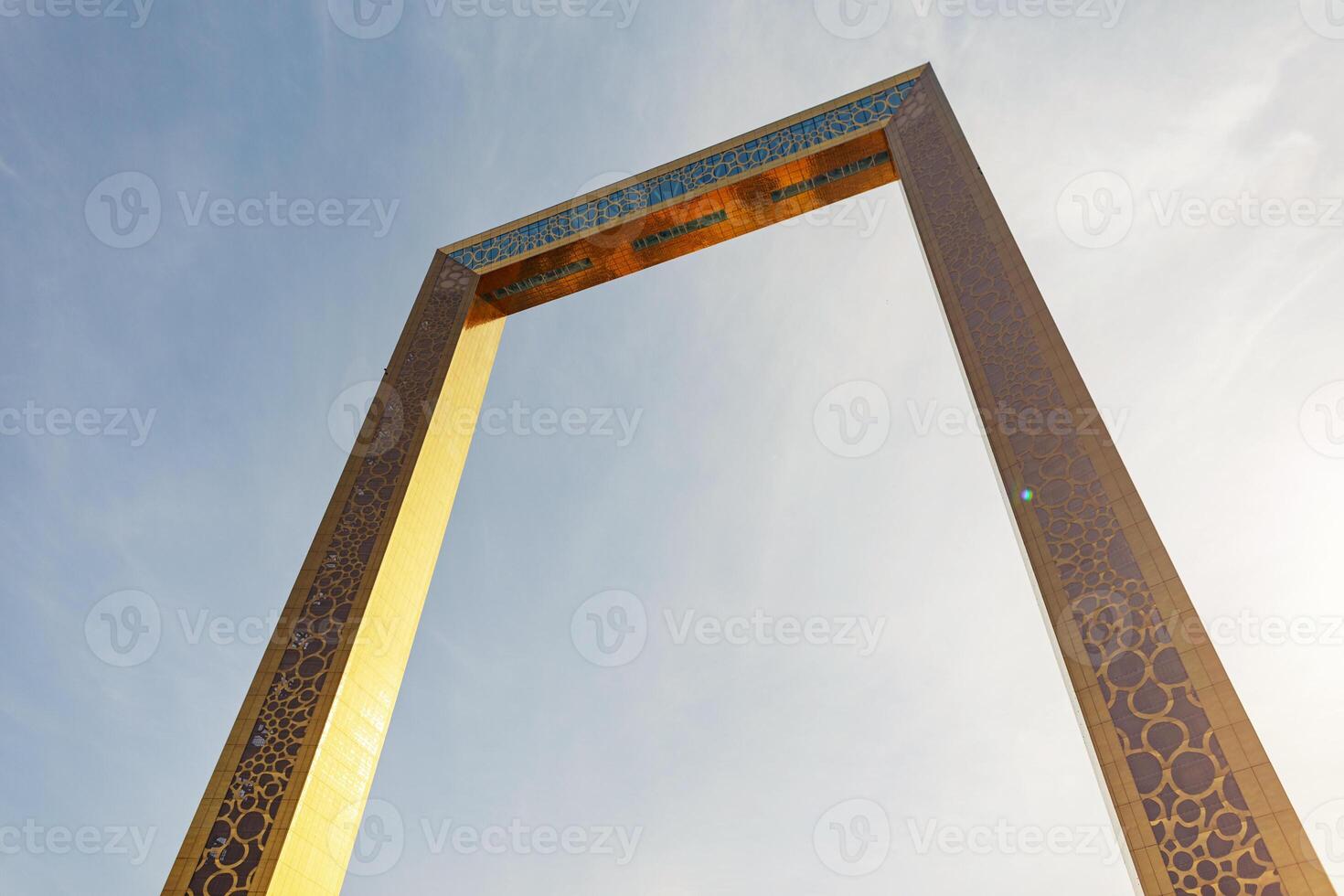 Amazing huge golden frame building in Abu Dhabi on a sunny day photo
