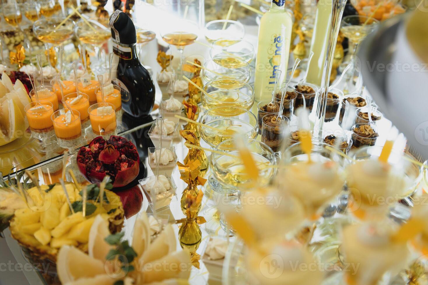 Delicious sweets on wedding candy buffet with desserts, cupcakes,tiramisu and cookies photo