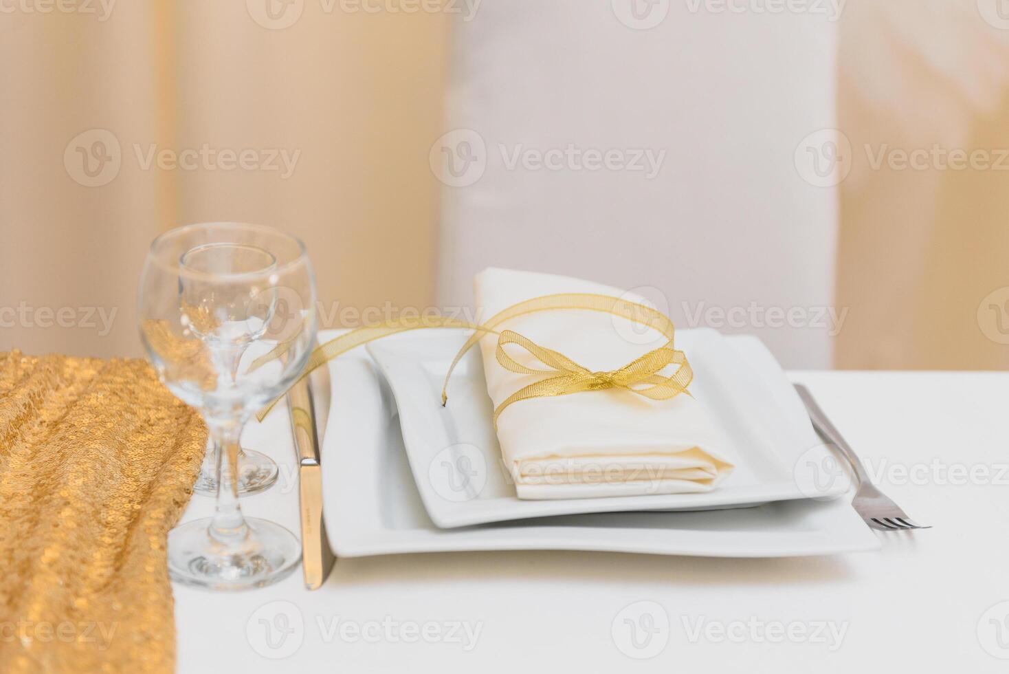 Glasses on the festive table setting. Wedding table decor concept. Table setting in classic style, setout. fine art. photo