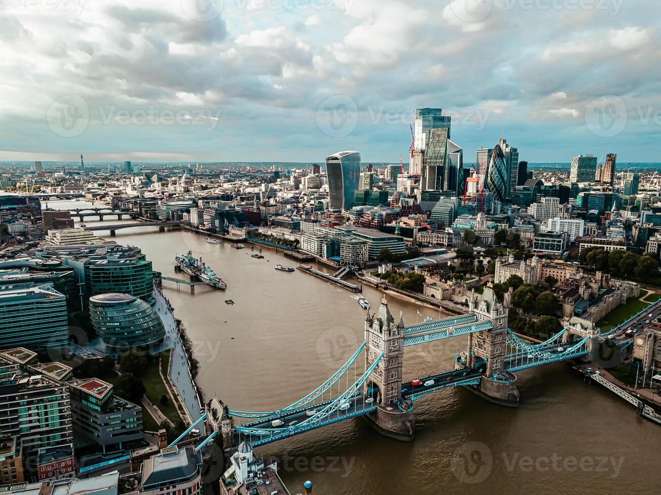Aerial view to the Tower Bridge and London city Business center , UK, just before sunset. Traffic going across the bridge. photo