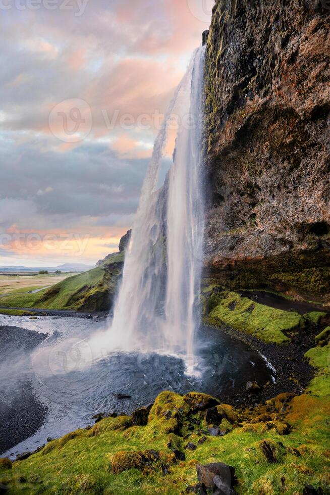 Stunning Seljalandsfoss Waterfall at Sunset, One of Icelands Most Popular and Breathtaking Natural Wonders photo