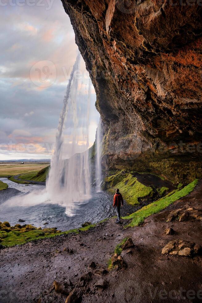 Stunning Seljalandsfoss Waterfall at Sunset, One of Icelands Most Popular and Breathtaking Natural Wonders photo