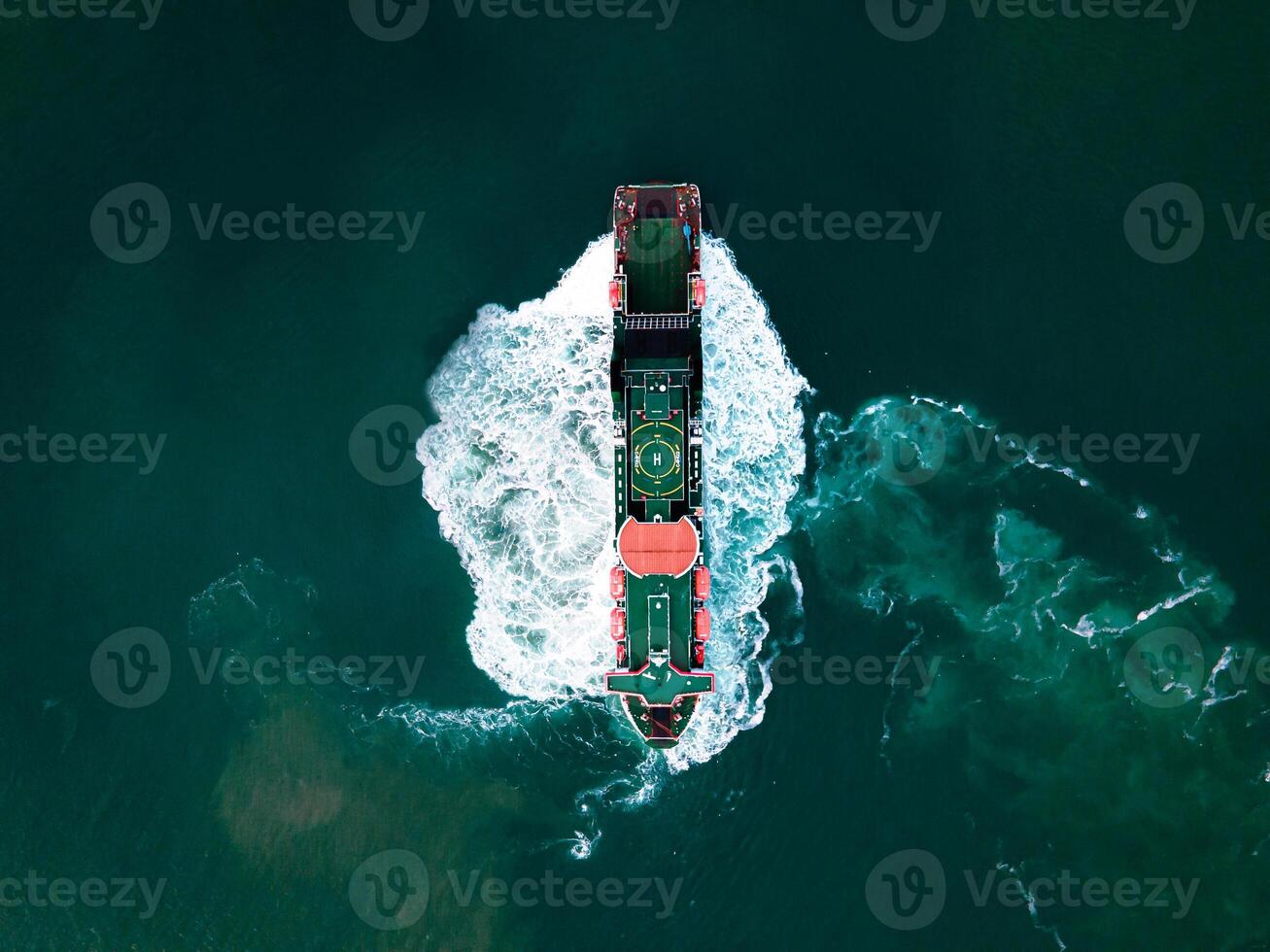 Aerial view of Empty cargo ship in port green water photo