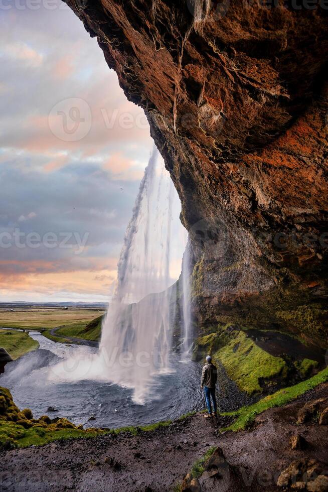 Stunning Seljalandsfoss Waterfall at Sunset, One of Icelands Most Popular and Breathtaking Natural Wonders photo