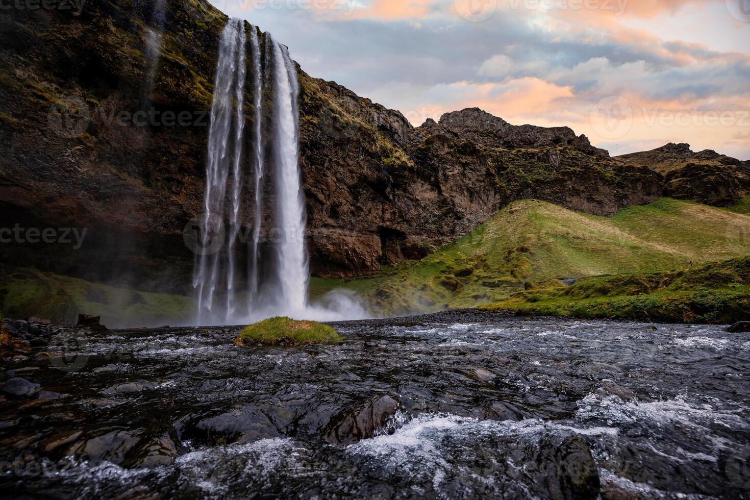 Stunning Seljalandsfoss Waterfall at Sunset, One of Icelands Most Popular and Breathtaking Natural Wonders photo
