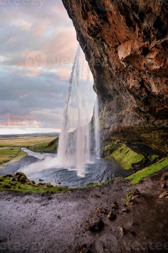 Stunning Seljalandsfoss Waterfall at Sunset, One of Icelands Most Popular and Breathtaking Natural Wonders photo