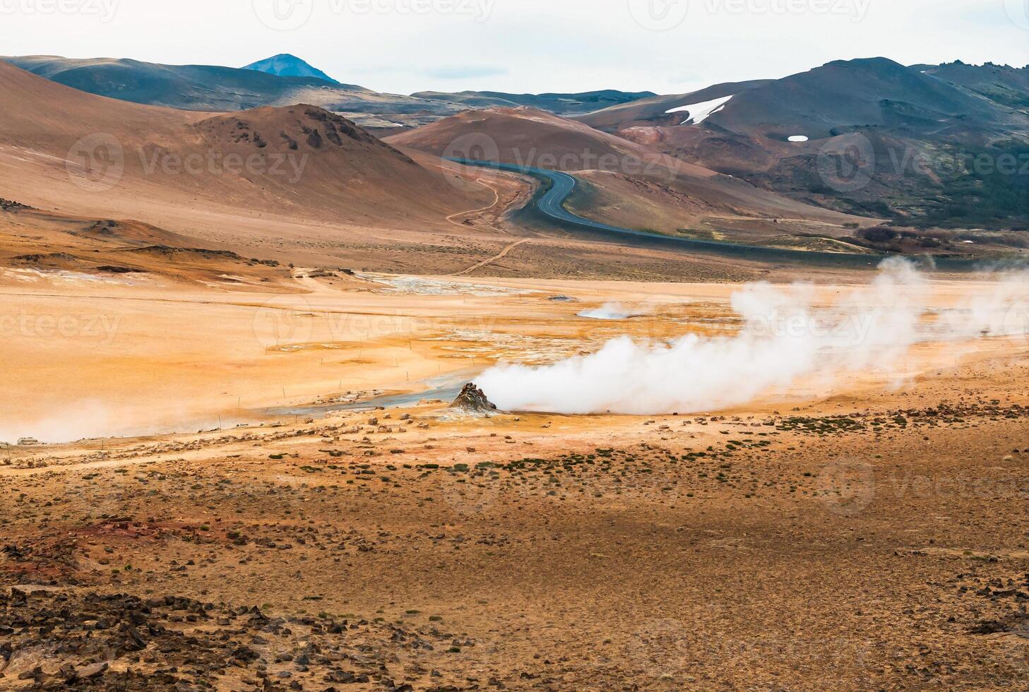 Aerial view of Hverir Geothermal Area in Iceland, capturing boiling mud pools, fumaroles, and the dramatic landscape of this geothermal hotspot near Lake Myvatn. photo