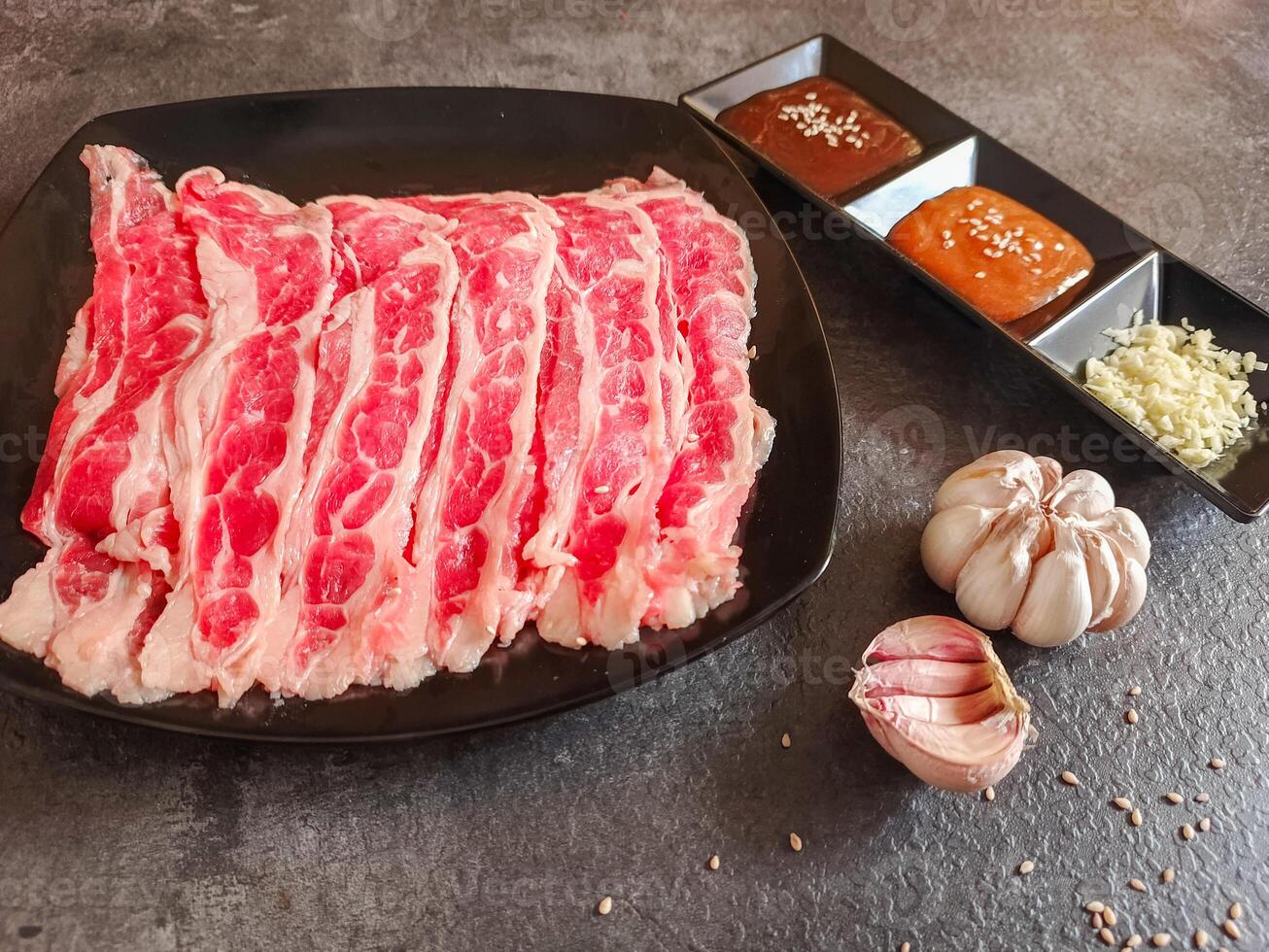 Ingredients for shabu-shabu dishes include sliced raw meat and processed ingredients for boiling which are based on seafood photo