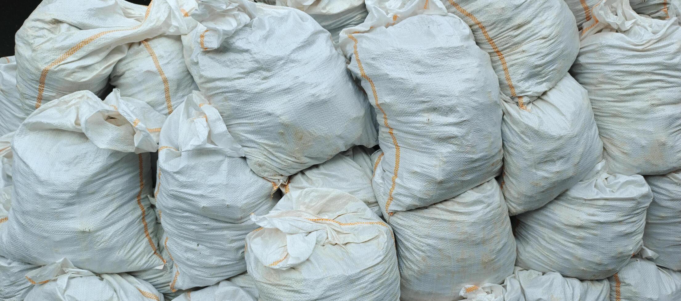 piles of sacks containing used debris from buildings that are being renovated or under construction photo