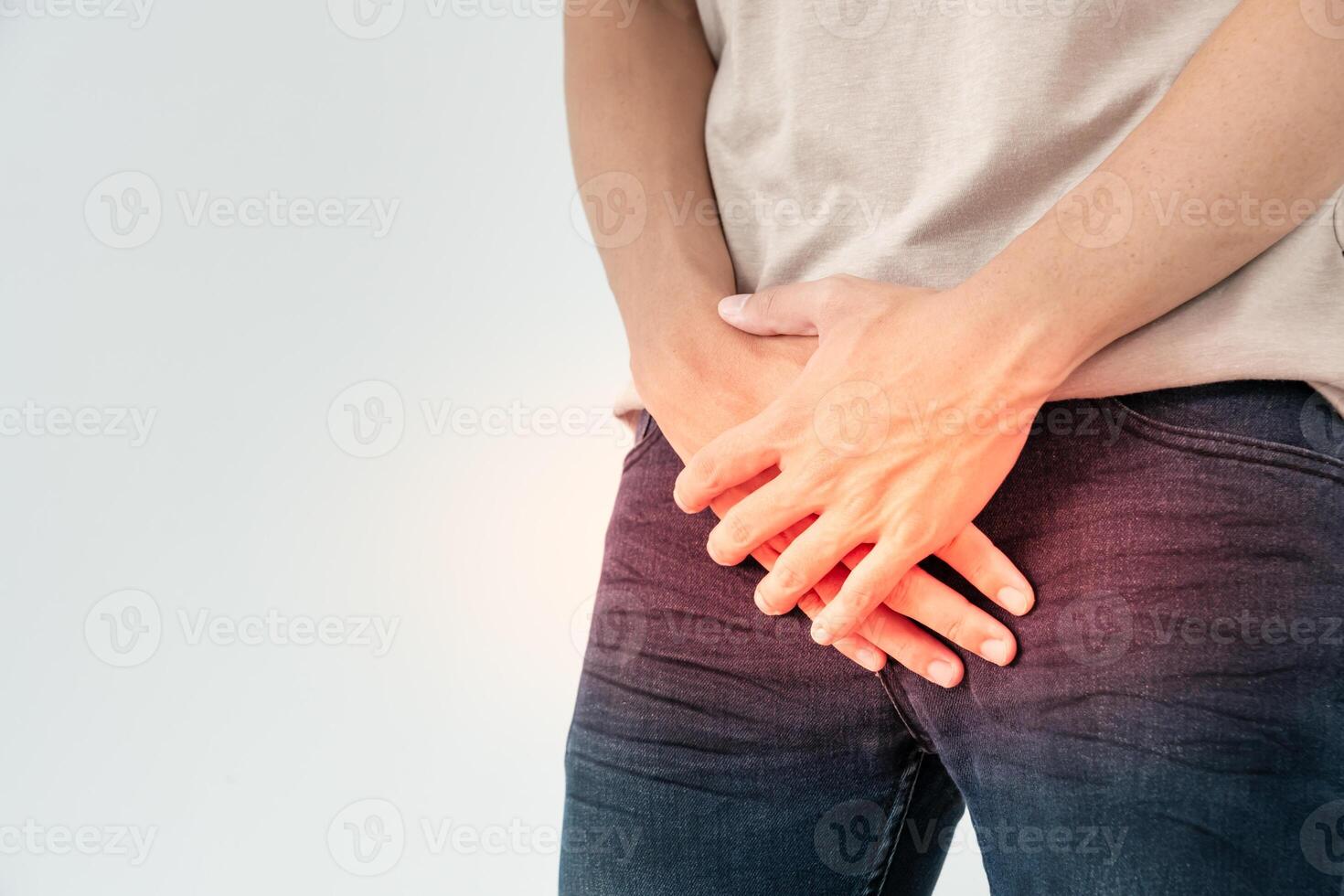 Man hold hand in front of private parts feeling discomfort from disease and inflammation. Venereal, testicular cancer. bladder problems, erectile dysfunction, premature ejaculation, prostate cancer photo