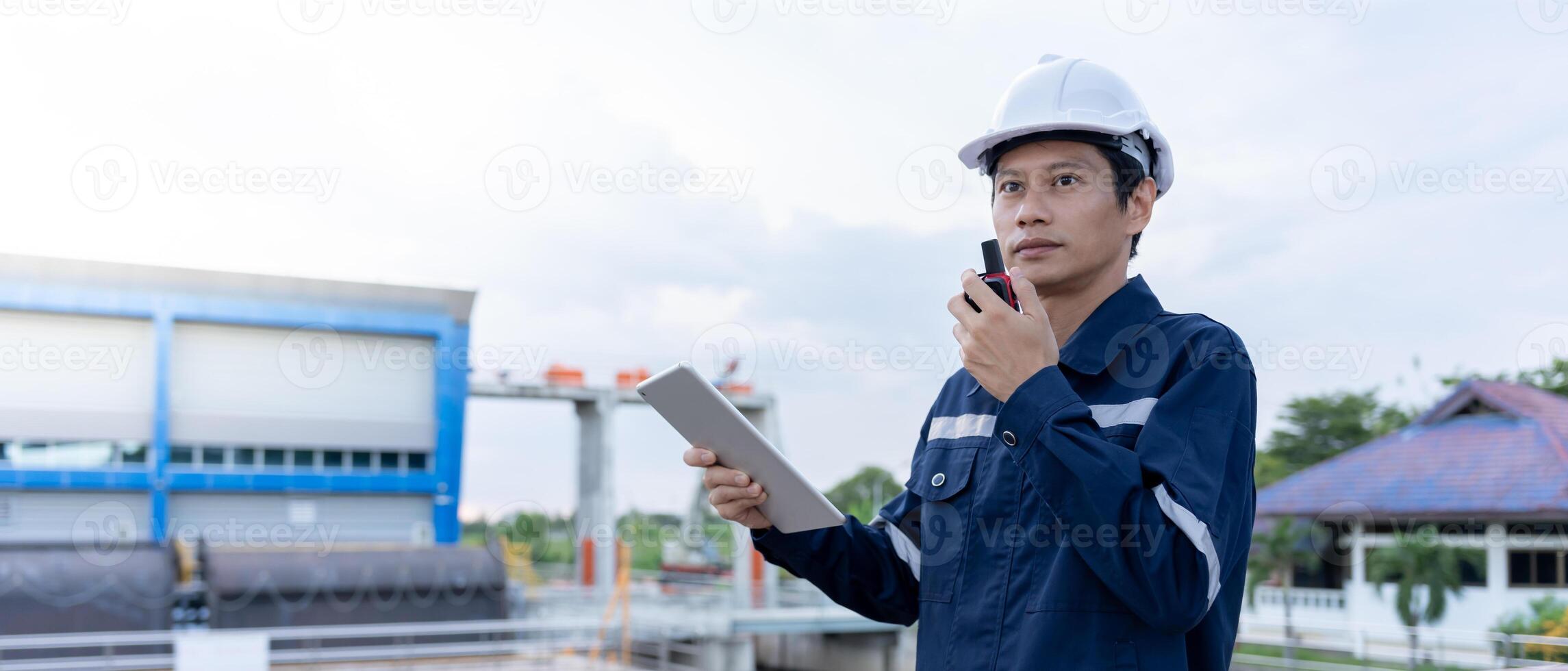 maintenance and inspector. Maintenance engineers are using walky talky to inform the results of inspection of buildings and structures. Irrigation engineers are exploring sluice systems photo