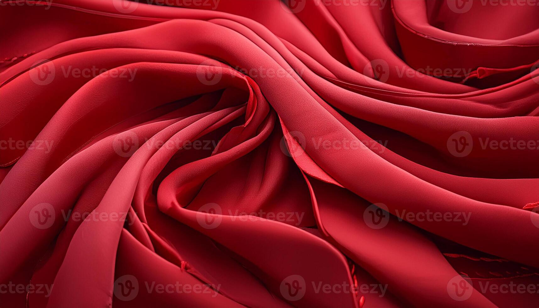 A red fabric with a spiral pattern. The fabric is red and has a shiny texture photo
