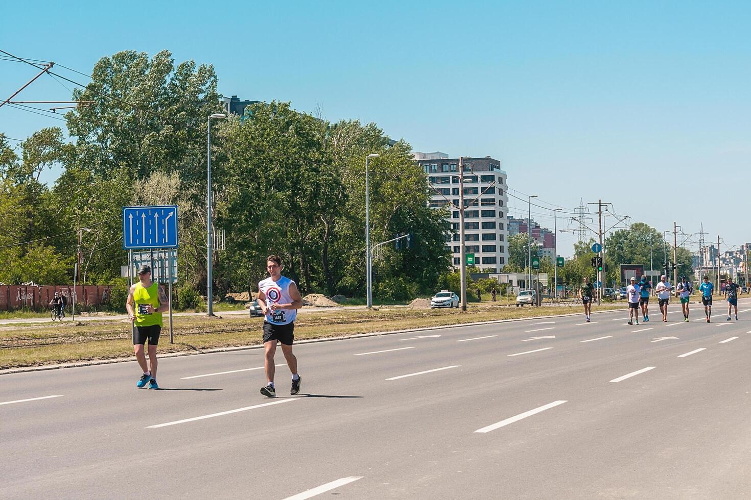 Belgrade, Serbia, April 28, 2024, 37th Belgrade Marathon Comtrade. People running a long distance marathon. Tired people runners looking for a second wind. photo