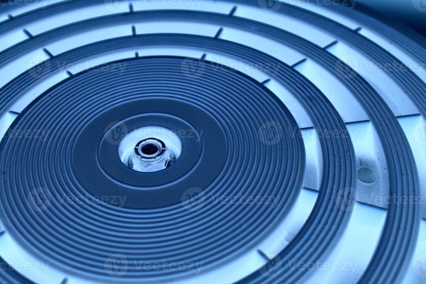 Accuracy concentric circles of varying thickness on a circular panel with blue lighting angle view photo