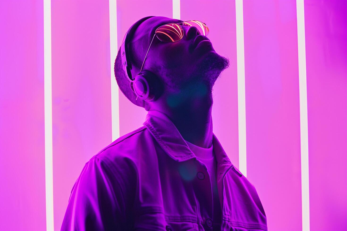 Handsome Male Model in Wireless Headphones with Neon purple Captured in a Trendy Lifestyle portrait Setting photo