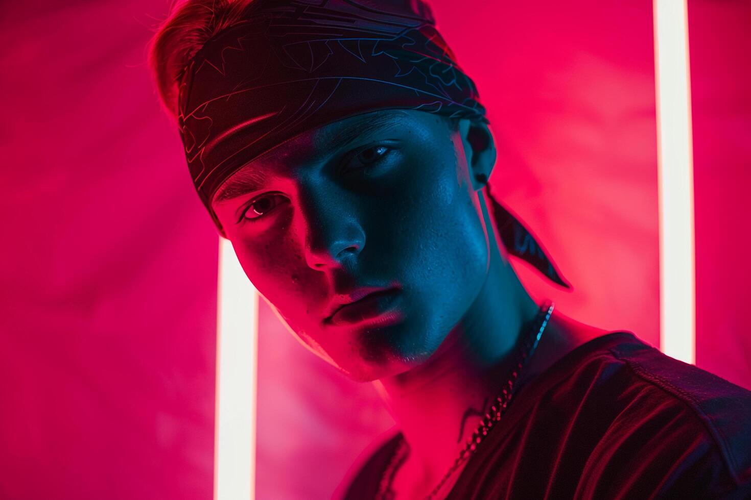 Fashion Male Model in Matte Black Bandana with Neon Coral Stylish Males portrait Featuring Vibrant Neon Coral Background photo
