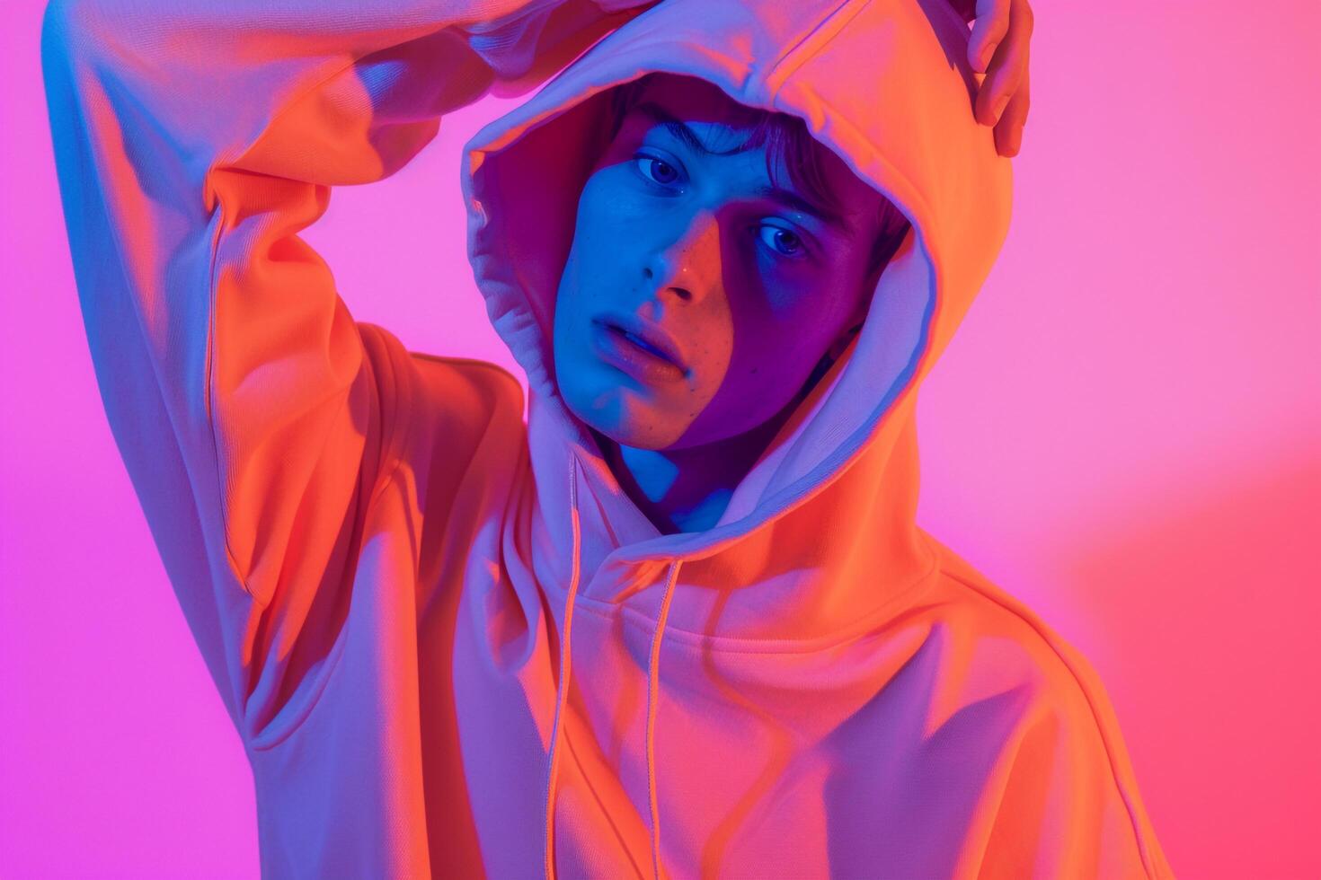Modern Handsome Fashion Male Model in Neon Orange Hoodie with Neon purple Highlights Set Against a Chic Lifestyle Background Stylish Males portrait photo