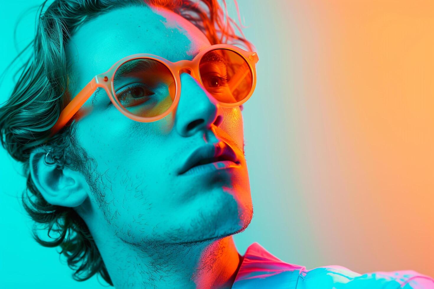 Handsome Fashion Male Model in Neon Orange eyewear with Neon Teal Background Stylish Males portrait photo
