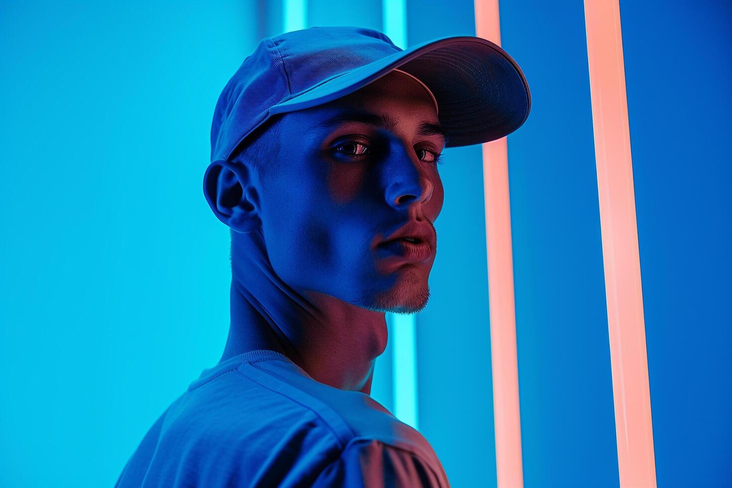 Fashion Male Model in Charcoal Gray Cap with Neon Blue Details Males portrait with Chic Look and Stylish Background photo