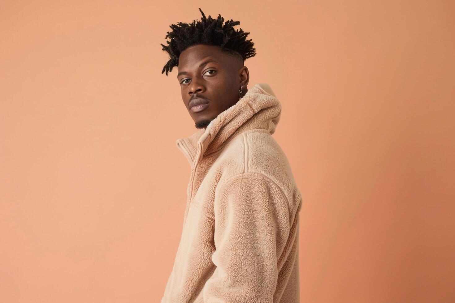 Trendy Fleece Jacket with Light peach Background Handsome Males portrait Featuring Stylish Fashion photo