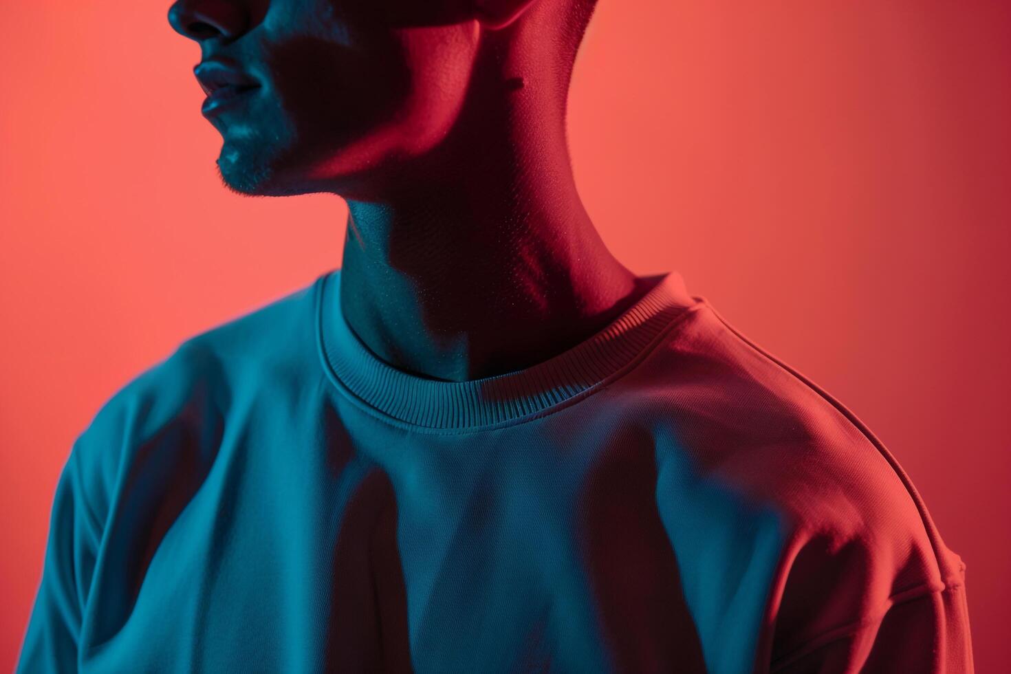 Fashionable Handsome Male Model in Casual Sweatshirt with Neon Coral Background perfect for High end Males portraits with Comfortable and Stylish Fashion eleMalets photo