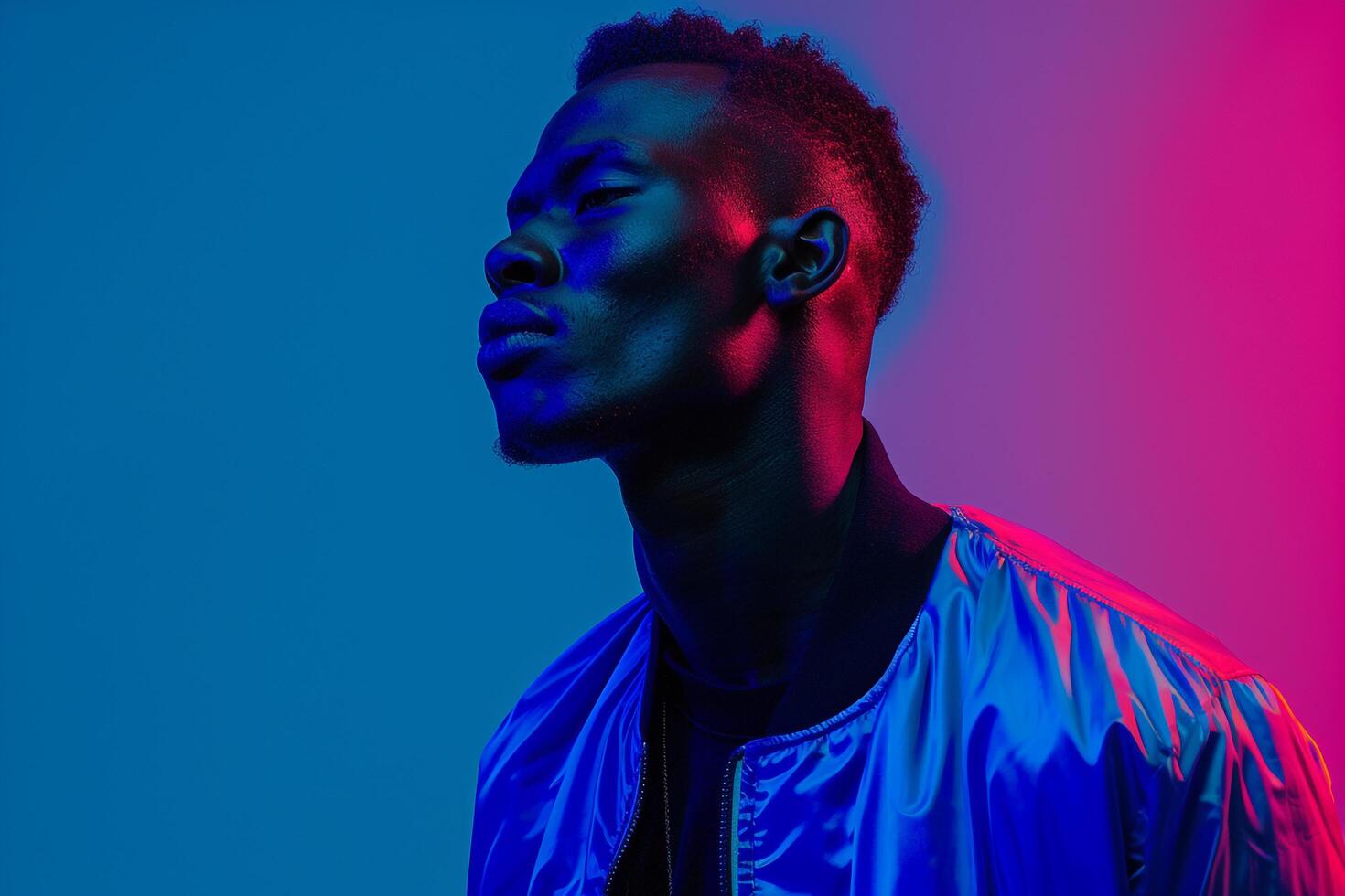Stylish male model in a casual bomber jacket with a neon blue background merging laid back fashion with bold neon colors for a dynamic and fashionable appearance photo