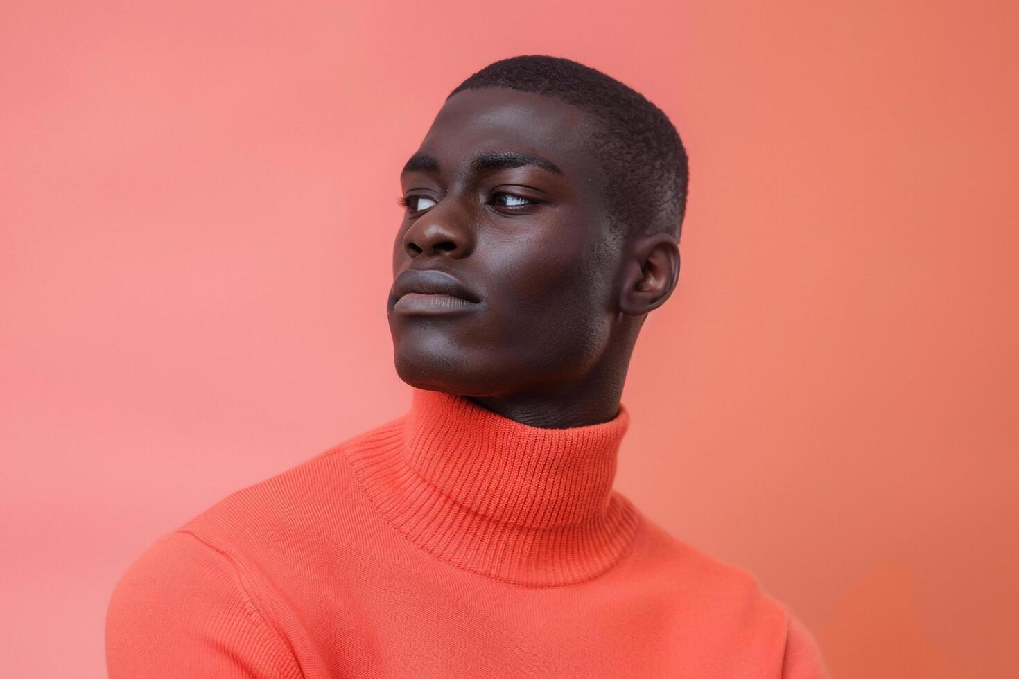 Handsome Fashion Model in pullover Light Coral Background Full length Lifestyle portrait emphasizing Trendy Males Apparel photo