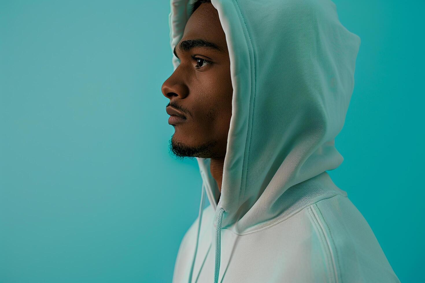 Stylish Hoodie Model in Soft Mint Background Lifestyle portrait Ideal for Trendy Males Fashion and Comfort photo