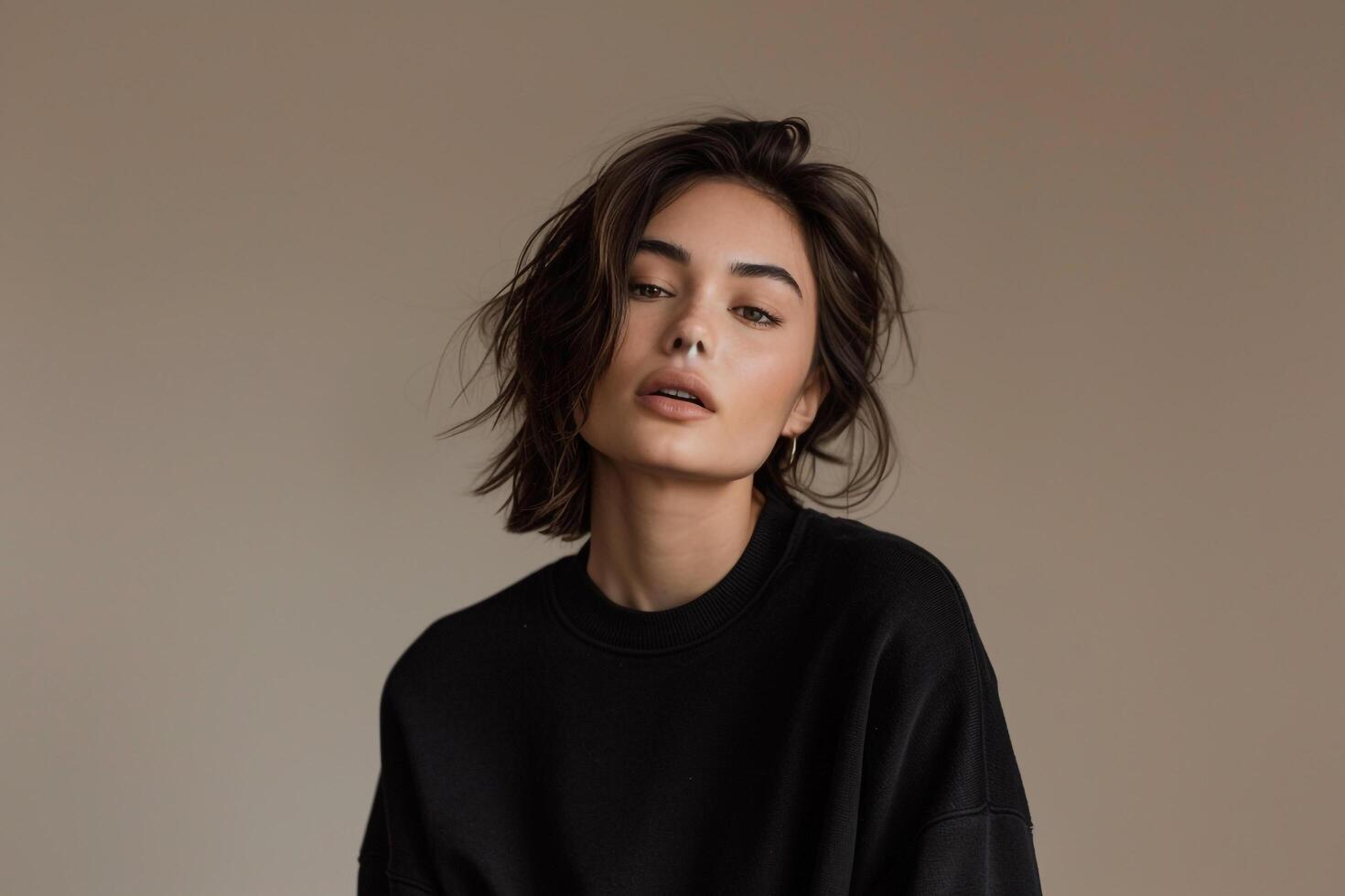 Classic Black Sweater on Handsome Male Model Light Taupe Lifestyle portrait Featuring Timeless Fashion and Modern Sophistication photo