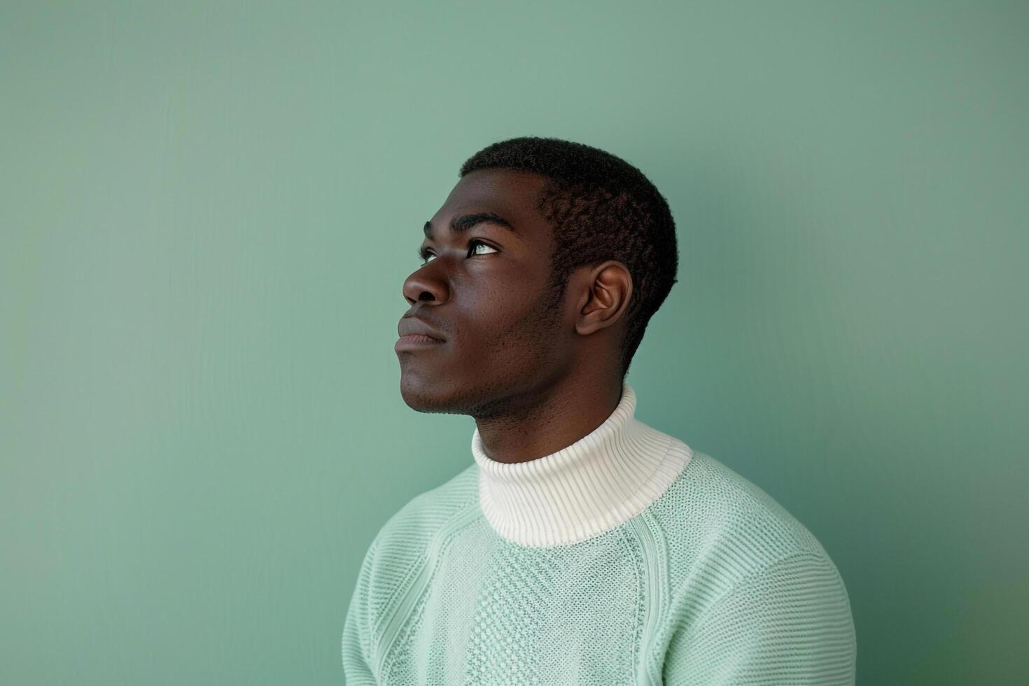 Stylish Fashion Model in a pullover with apale green Lifestyle Males portrait Fashion Male Background capturing a costume and high fashion portrait in the male dress photo