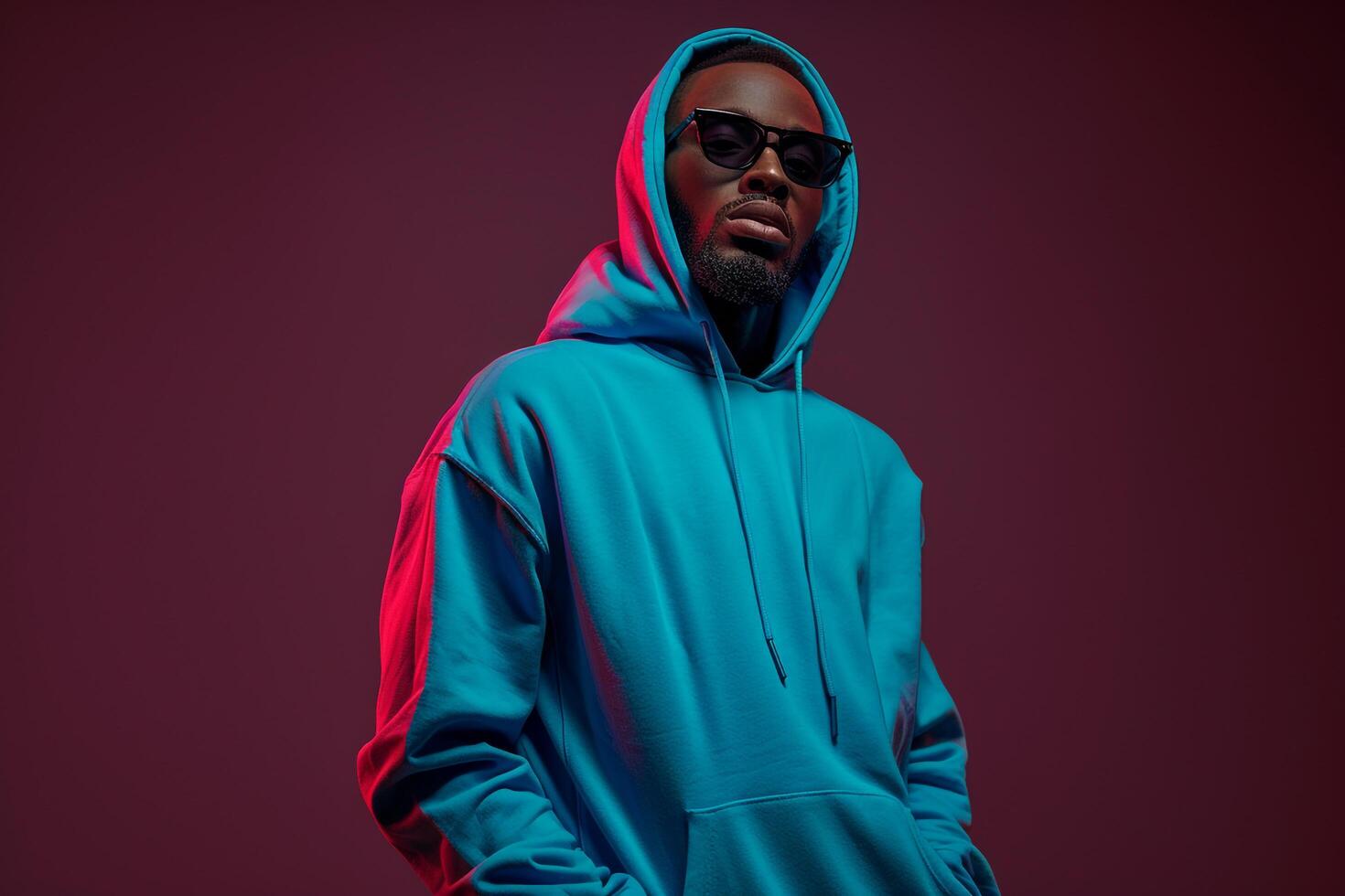 Bright Blue Hoodie and Sunglasses Urban Lifestyle portrait with Dark Burgundy Fashion Details for Trendy Male Look photo