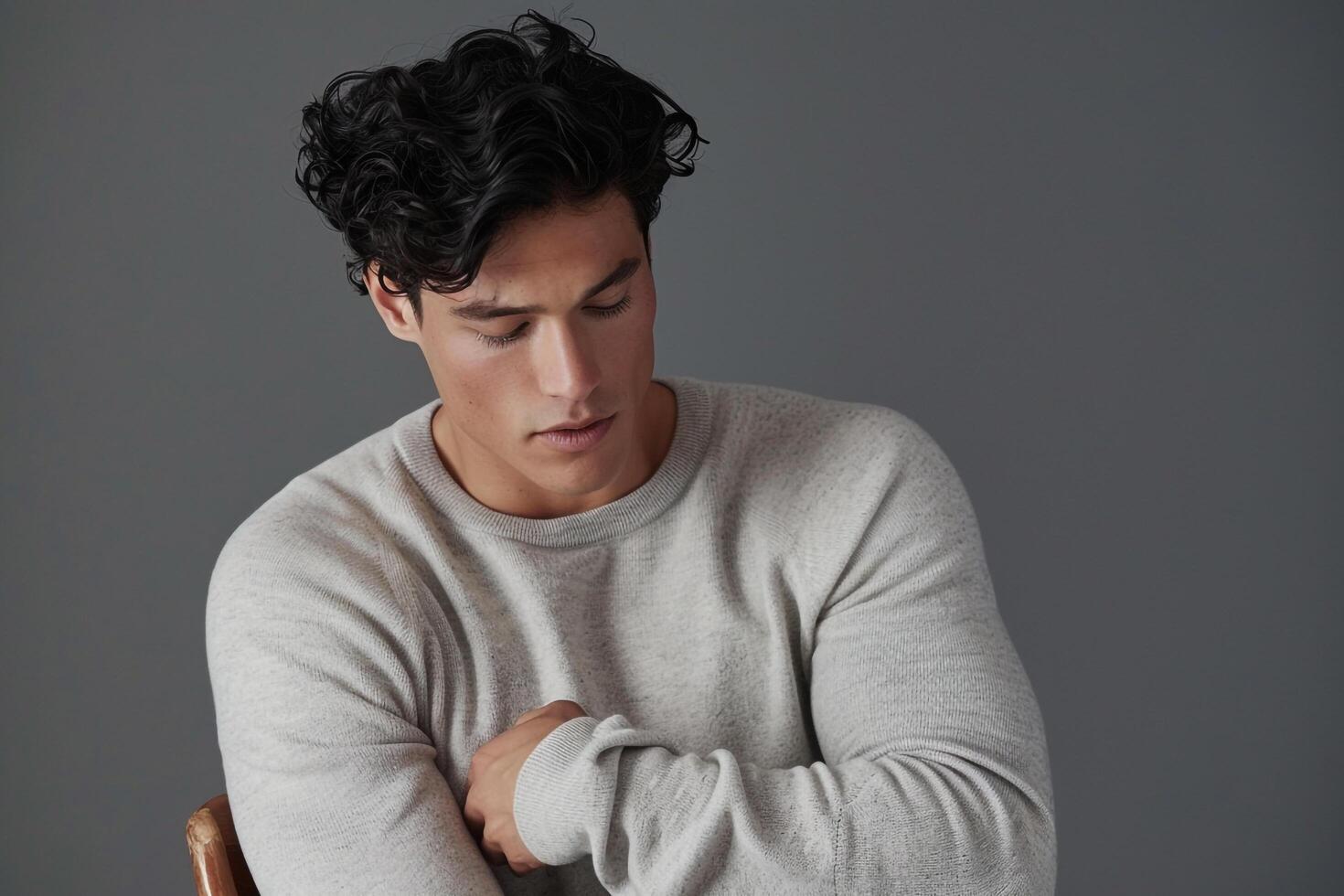 casual pullover with aheather grey male background male dress portrait highlighting relaxed lifestyle Males fashion photo