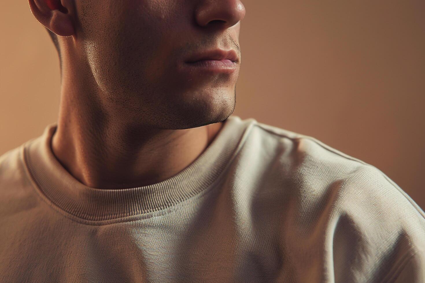 Stylish male model in comfortable sweatshirt with earthy tan modern fashion portrait relaxed lifestyle photo