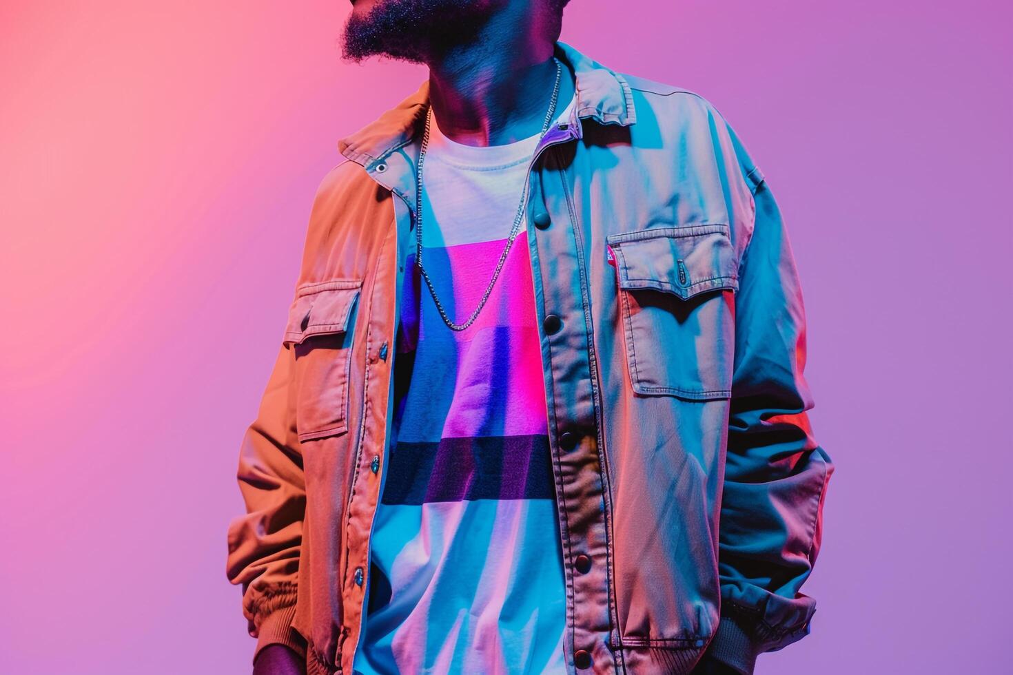 elegant male model in a graphic tee and stateMalet jacket with a neon purple background showcasing a fashionable portrait and a trendy lifestyle photo