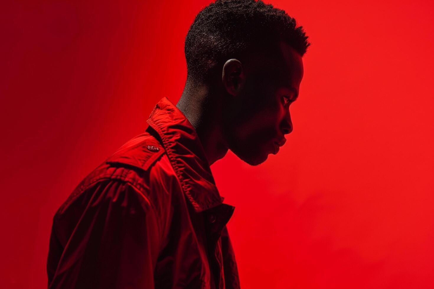 Chic male model in a red stateMalet jacket showcasing a stylish portrait and a trendy lifestyle photo