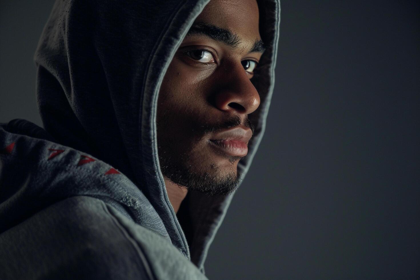 Trendy Dark Grey Hoodie on a male model featured in a relaxed lifestyle setting showcasing modern and casual Males fashion choices photo