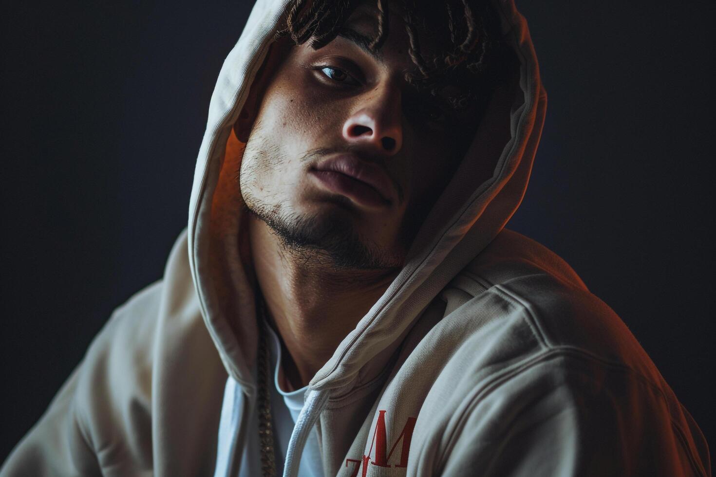 Fashionable Jet Black Hoodie on a male model featured in a relaxed lifestyle setting highlighting contemporary and stylish Males fashion photo