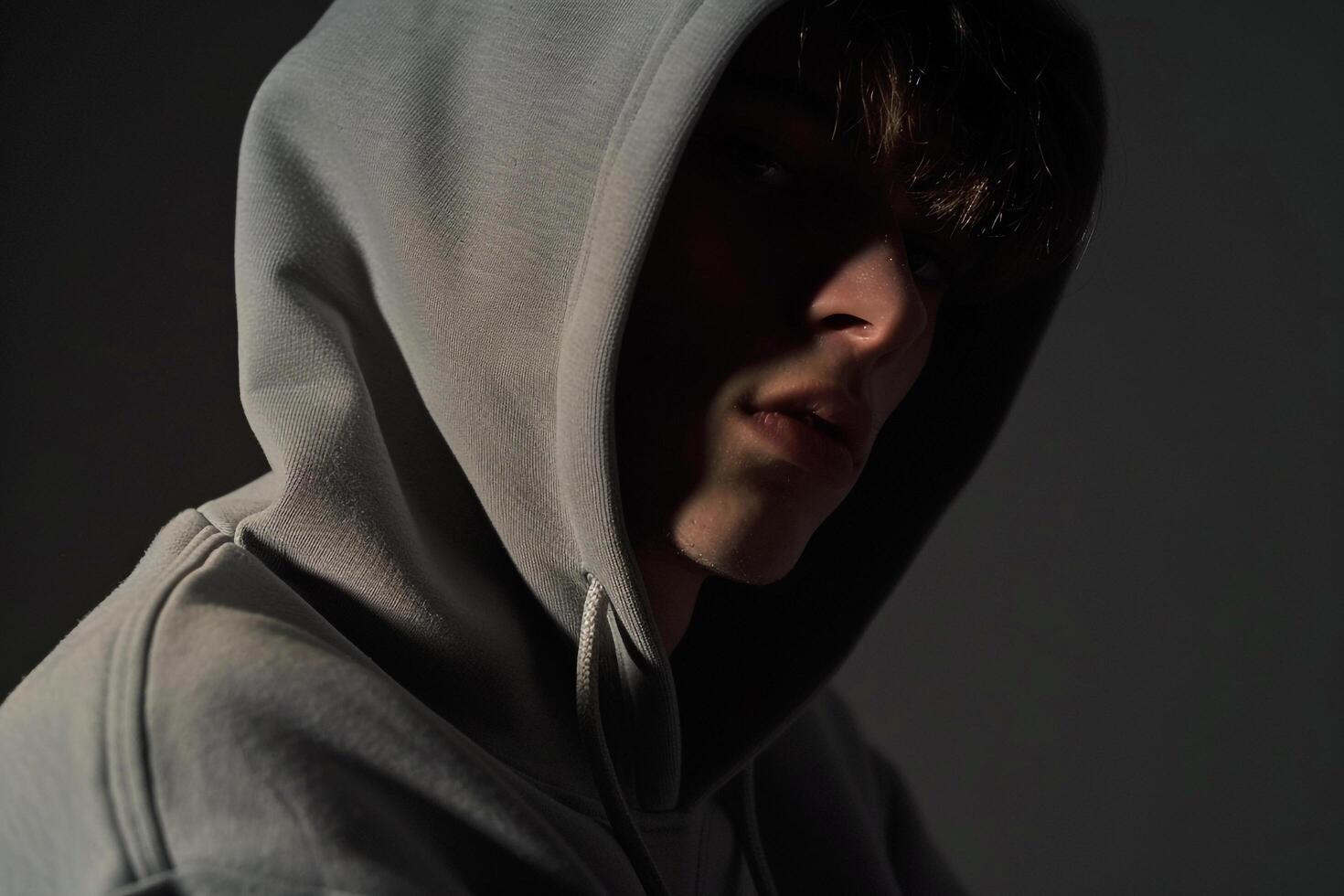 elegant male fashion model in a Hoodie with Jet Black background showcasing a fashionable lifestyle portrait of modern Males style photo