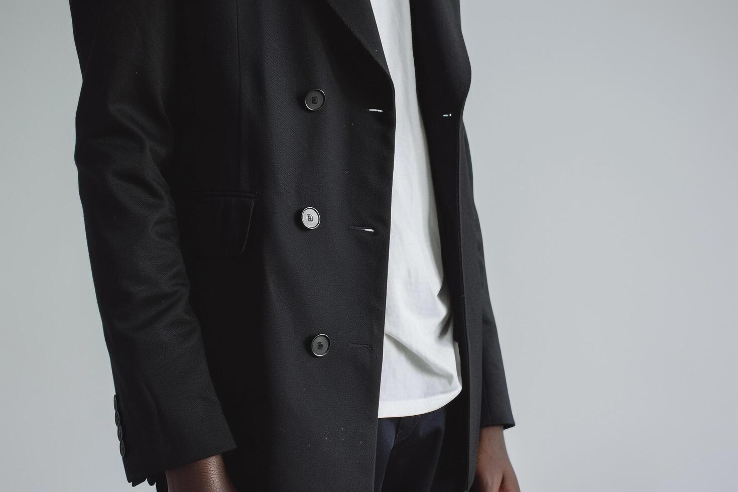 elegant male model in an istt blazer with a white wear background modern portrait emphasizing stylish and refined Males fashion choices photo