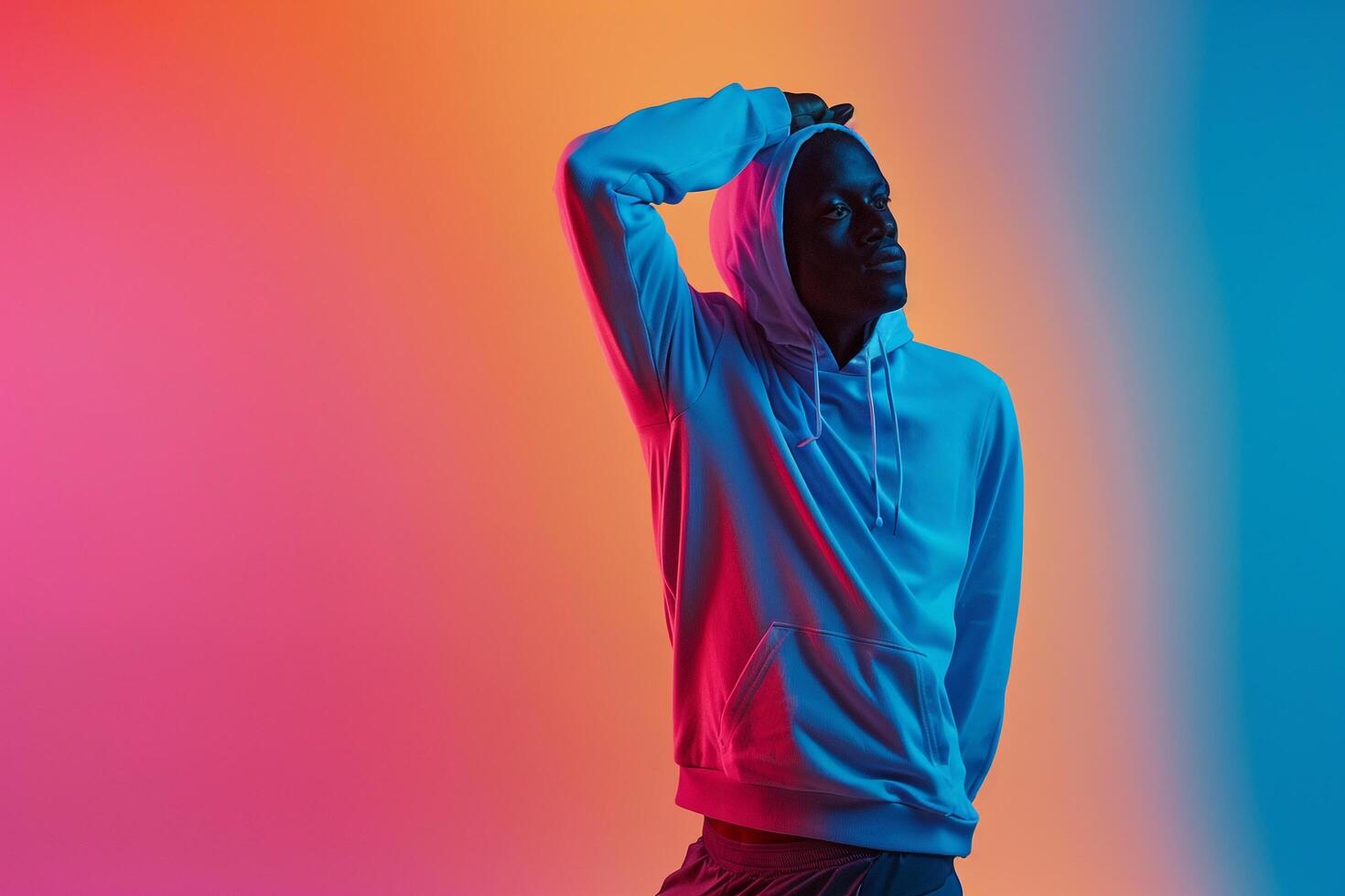 Fashionable male model in perforated gear with a clothing gradient background emphasizing contemporary athletic aesthetics and stylish design with flair photo