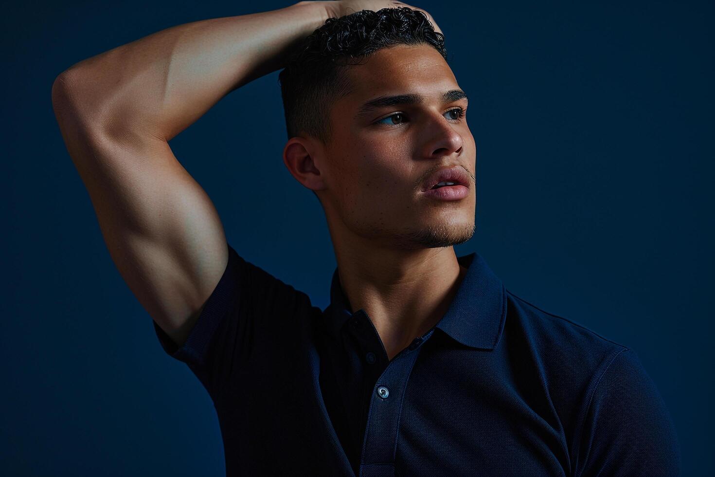 Handsome male model in a rich navy polo shirt with a dynamic background Ideal for showcasing classic Males fashion with a modern twist in high quality fashion portraits photo