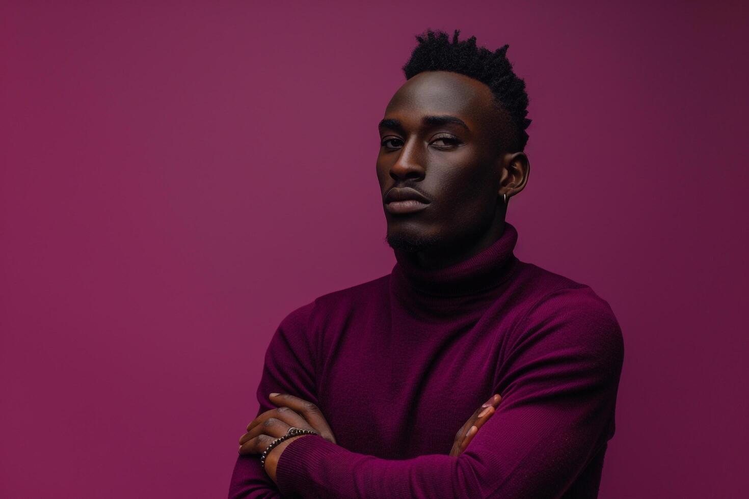 Chic male fashion model in a pullover with a royal purple background featuring a stylish fashion look and a modern lifestyle photo