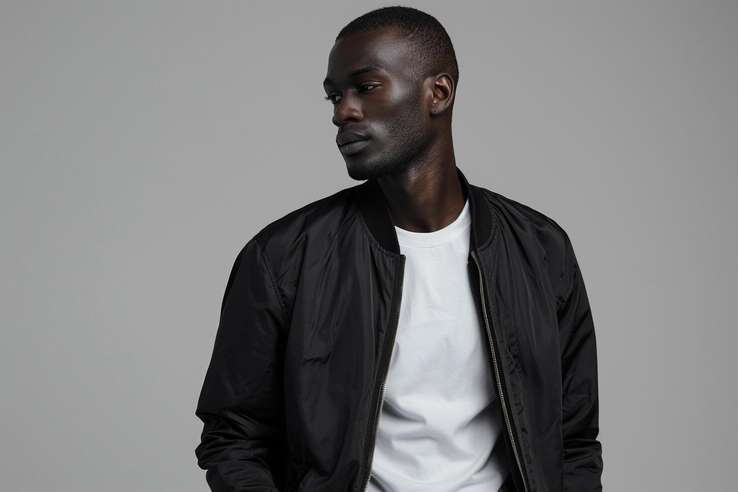 Trendy male fashion model in a zip up jacket focusing on lifestyle and modern portrait with a fashionable background photo