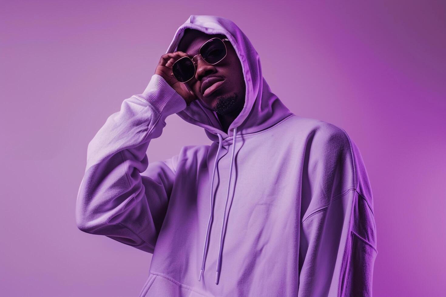 Light Lilac Background Featuring Male in Hoodie  Lifestyle portrait Highlighting Serene Colors photo