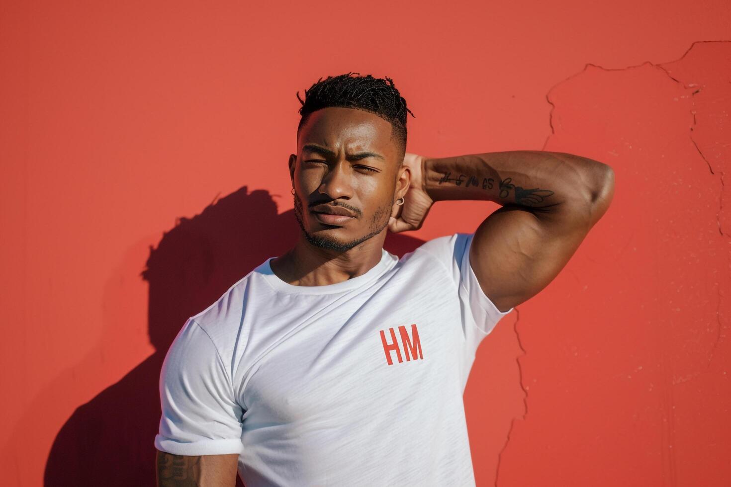 Red Background and Male in T Shirt  Lifestyle portrait emphasizing Bright Casual Fashion photo